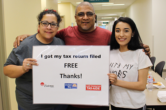 Entergy customers Melissa, Peter and Aleesia Delgado get their taxes done at Super Tax Day 2018.